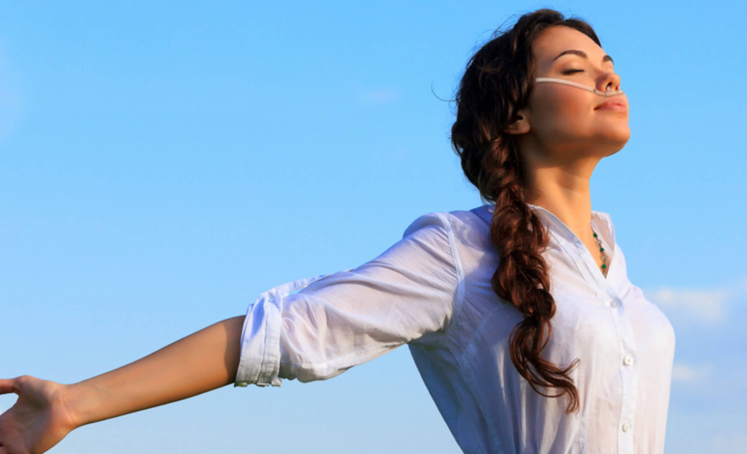 a woman breathing easily due to oxygen concentrator